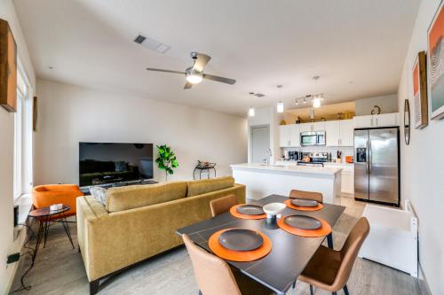 a kitchen and living room with a table and chairs at Downtown Apartment with Riverwalk views Free Parking Pet Friendly Centrally Located on the Riverwalk in San Antonio