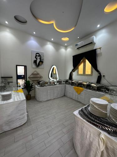 a hair salon with tables and plates on display at Chalet LV in Hafr Al Baten