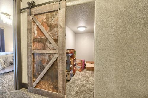 a sliding barn door in a room with a bedroom at Wernski Lodge in Lead