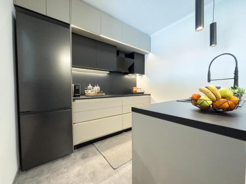 a kitchen with a bowl of fruit on a counter at Ixia home in Ixia