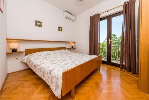 Postel nebo postele na pokoji v ubytování House Oleander