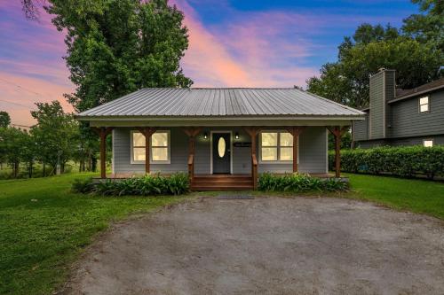a small house with a gambrel roof at Old and Lost River Home on the river by Super Hosts instant book barbers hill wifi work space fishing hunting bird watching in Baytown