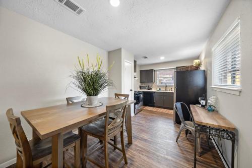 a kitchen and dining room with a table and chairs at Sandy Private Beach Oasis Close to Kemah Boardwalk & NASA 5 STAR SUPER HOST in Seabrook