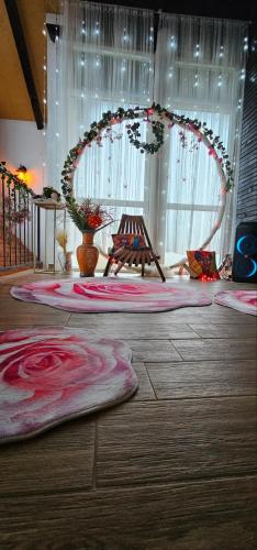 a living room with a large room with areath and a table at Vikendica OM relax in Prijedor