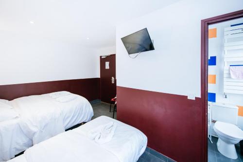 Ένα ή περισσότερα κρεβάτια σε δωμάτιο στο Hotel De La Poste