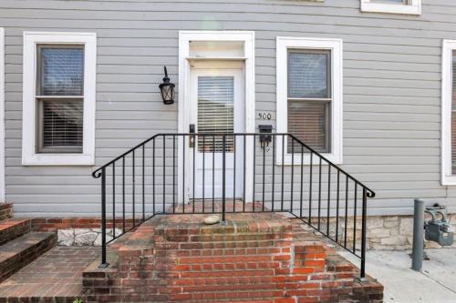 a house with a staircase in front of a door at Housepitality - The Marienplatz - Free Parking in Columbus