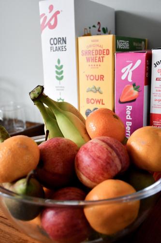 a bowl of fruit with apples oranges and bananas at Meadowsweet House in Stockton-on-Tees