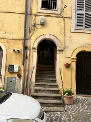 a stairway leading to a building with a stair case at Casetta incantevole Genzano di Roma in Genzano di Roma