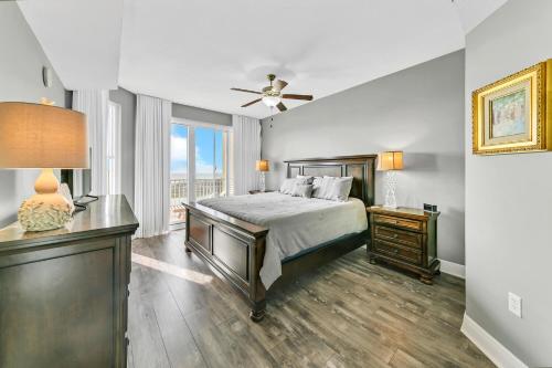 a bedroom with a bed and a ceiling fan at Ariel Dunes II 1301 in Destin