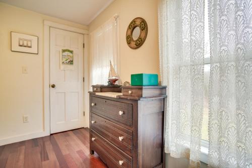 a room with a dresser and a window with a mirror at Beautiful Aquinnah Home Ocean View, Walk to Beach in Lobsterville