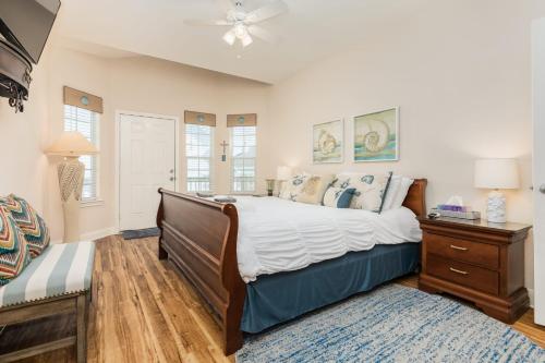 a bedroom with a bed and a dresser and a window at Amazing 360 Ocean & Bay Water Views in Freeport