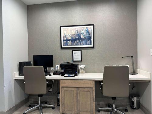an office with a desk with two computers and two chairs at Best Western Plus Chandler in Chandler