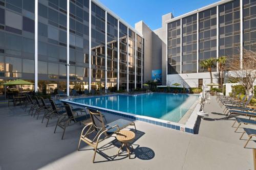 a swimming pool in front of a building at Best Western Orlando Gateway Hotel in Orlando