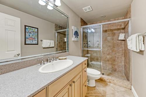 a bathroom with a sink and a toilet and a shower at Majestic Sun 1205B in Destin