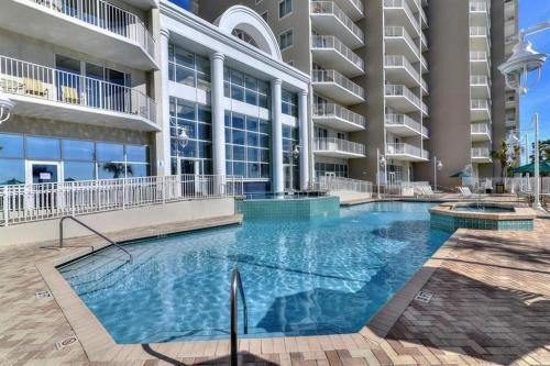 a large swimming pool in front of a building at Majestic Sun 1205B in Destin