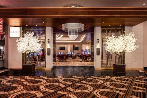 a lobby of a hotel with a large rug at Horseshoe Lake Charles, A Caesars Destination in Lake Charles