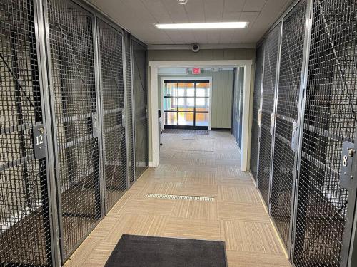 a hallway with inmate cellars in an office building at Stroll to Slopes, Village Area, Ski in-out MtLodge 219 in Snowshoe