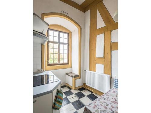 a kitchen with a sink and a window in it at Lovely apartment in Unsleben in Unsleben