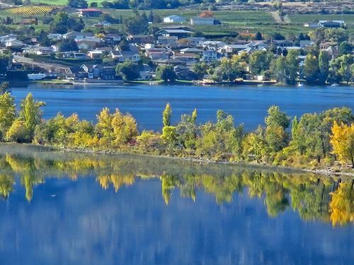 a view of a lake with houses and condos at La Dolce Vita B and B in Osoyoos