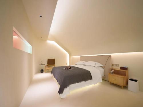 Cama o camas de una habitación en Wang Yun Residence Boutique Homestay