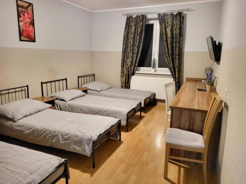 Una cama o camas en una habitación de LAWENDA Pokoje Gościnne