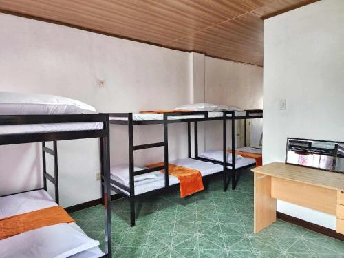 Postel nebo postele na pokoji v ubytování Golda Coast Resort - Oslob