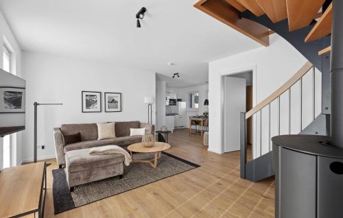 a living room with a couch and a table at Rundumblick in Winterberg