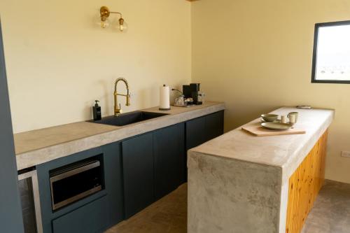 a kitchen with a sink and a counter at MiLu in El Porvenir