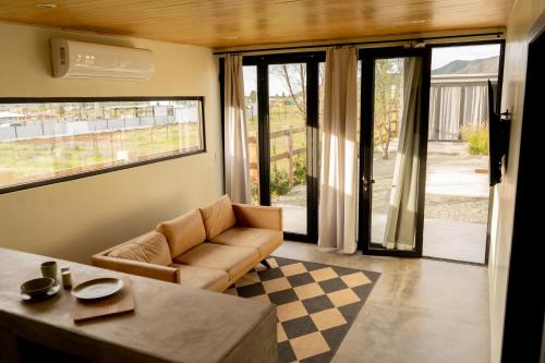 a living room with a couch and a table at MiLu in El Porvenir