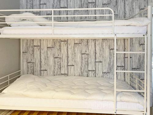 a couple of bunk beds in a room at 8 person holiday home in ANNEBY-By Traum in Aneby