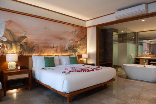 Ένα ή περισσότερα κρεβάτια σε δωμάτιο στο AnandaDara Ubud Resort & Spa