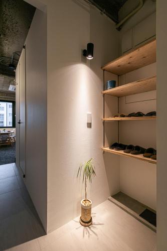 a plant in a pot in a room at City Center Villas ゲストハウス35 supported by COCOSTAY in Hijiyamachō
