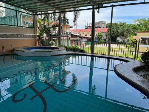 a swimming pool at a resort with a swimming pool at D'Mariners Inn Hotel in Batangas City