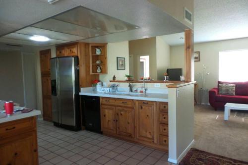 a kitchen with a sink and a refrigerator at Water Front Sweet Home in Mesa