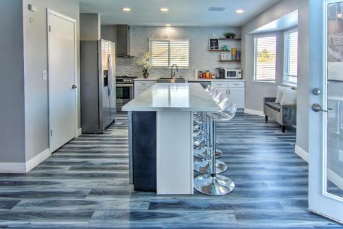 a kitchen with a island in the middle of a room at HOUSE VEGAS in Las Vegas