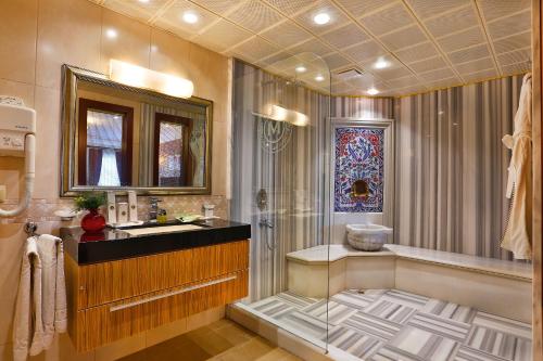 a bathroom with a shower and a sink at Mosaic Hotel Old City -Special Category in Istanbul