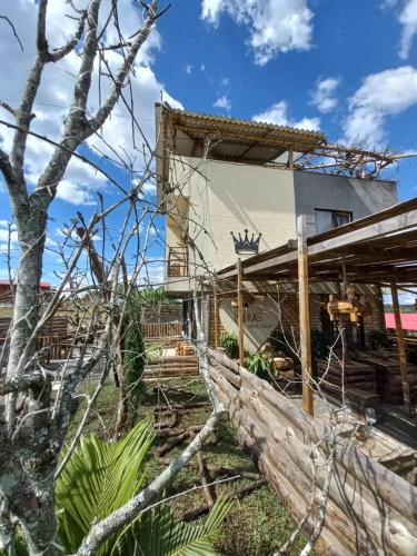 a house with a fence in front of it at Vibras in Popayan