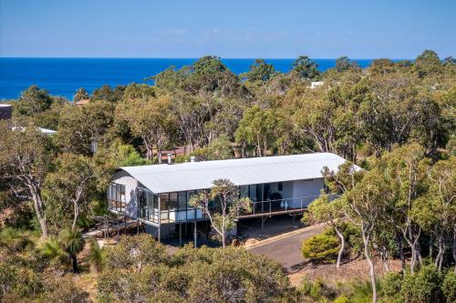 an aerial view of a house in the trees at Matilda I Private Properties in Dunsborough