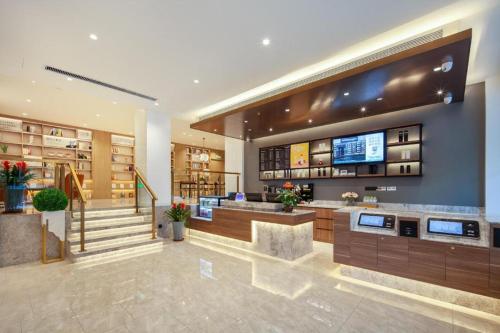 Lobbyen eller receptionen på Hanting Hotel Jinan Jingsi Road Zhongshan Park