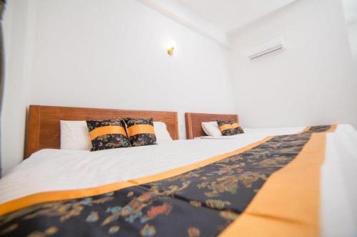 Postel nebo postele na pokoji v ubytování Baoguan Mountain Hotel