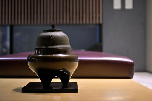 a black and white object sitting on top of a table at Hotel Resol Kyoto Shijo Muromachi in Kyoto
