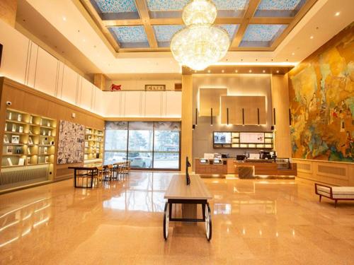 Ο χώρος του λόμπι ή της ρεσεψιόν στο Hanting Hotel Changchun Gongnong Square Metro Station