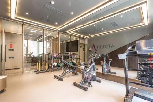 a gym with several exercise bikes in a room at Atour Hotel Shenyang Heping Street Dongbei University in Shenyang