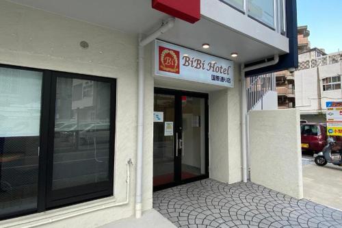 a building with a sign on the side of it at BIBI hotel kokusaidori in Naha