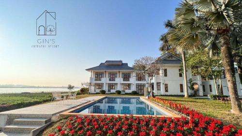 an image of a house with a swimming pool at Gin's Greenery Resort in Ban Hua Wiang