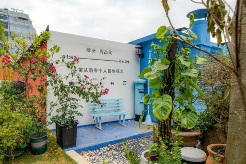 a blue and white building with writing on it at F-TOWN Fangtang Hotel (Shenzhen Longgang Tian'an Digital City Huanggekeng Subway Station) in Shenzhen