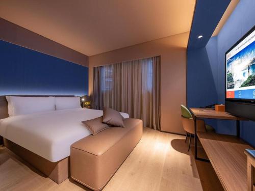 Letto o letti in una camera di Orange Hotel Beijing Shangdi Annig Zhuang
