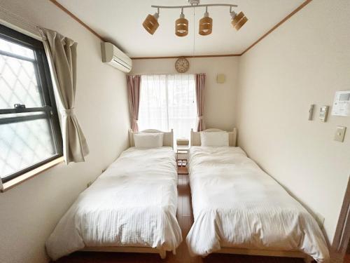 Una cama o camas en una habitación de さくら荘　102号室