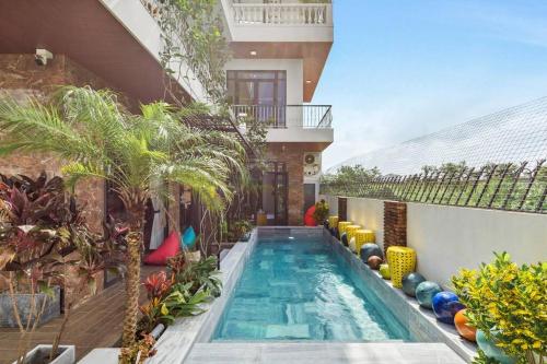 a swimming pool in the middle of a house at Sol Villa 4BR, Pool, Near Han River, Camp Fire in Da Nang