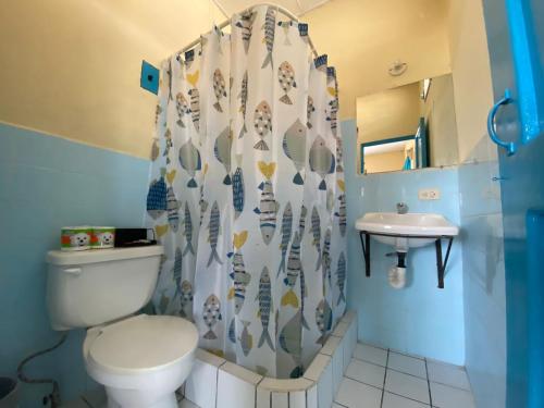 a bathroom with a toilet and a sink at Casa D'Andrea in Flores